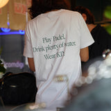 ‘KIN Play Padel Tee